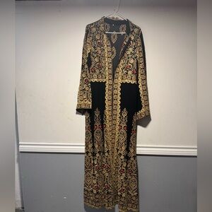 Elegant Black and Gold Embroidered Long Open Abaya worn .